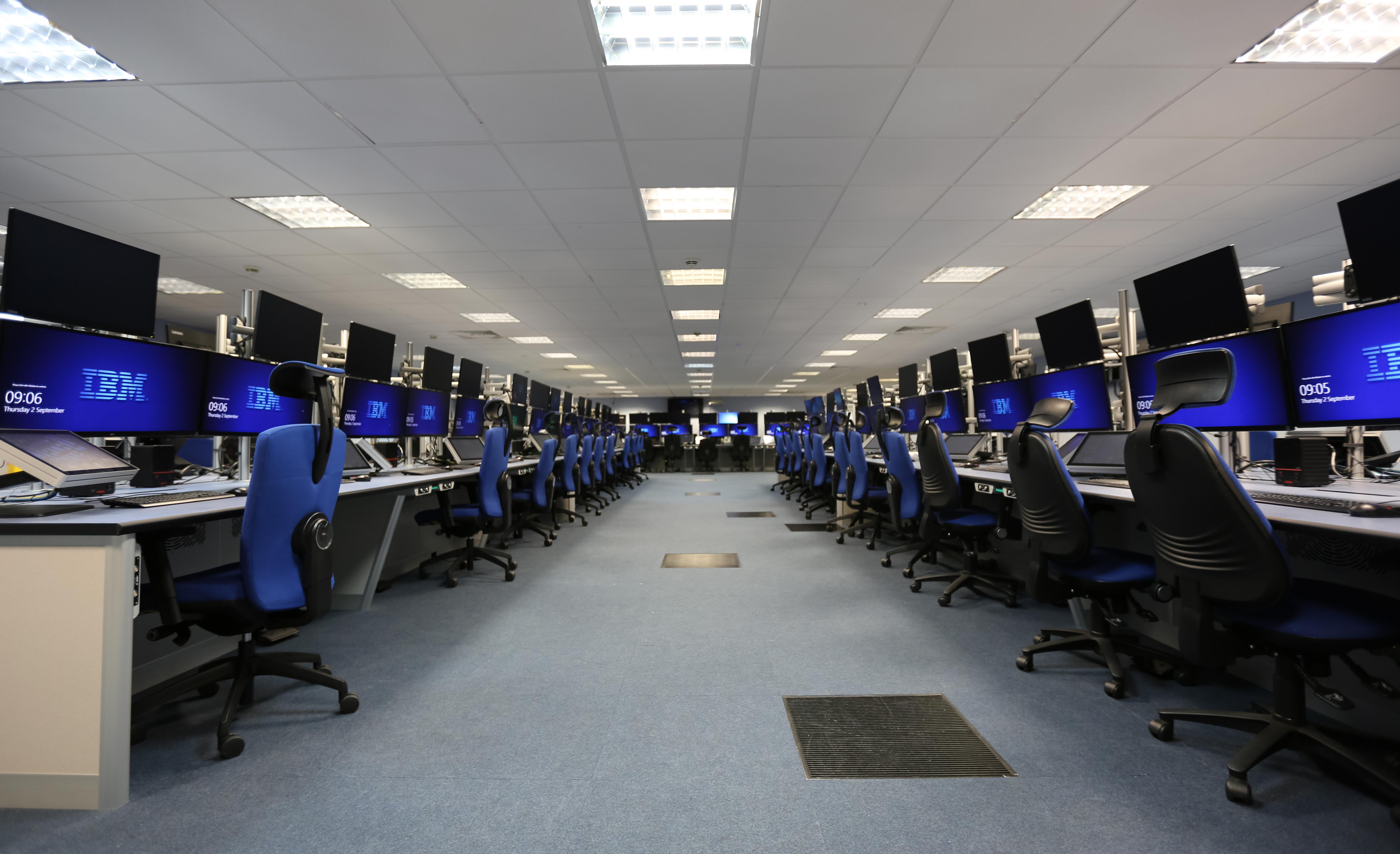 Control room of computers and desks.